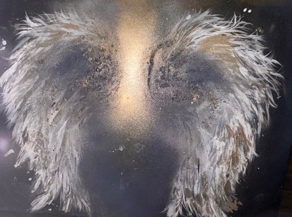 Angel wings painted for Deana Losasso with her father's cremation ashes &mdash; white and gold feathered wings and a shaft of gold light on a midnight-blue canvas