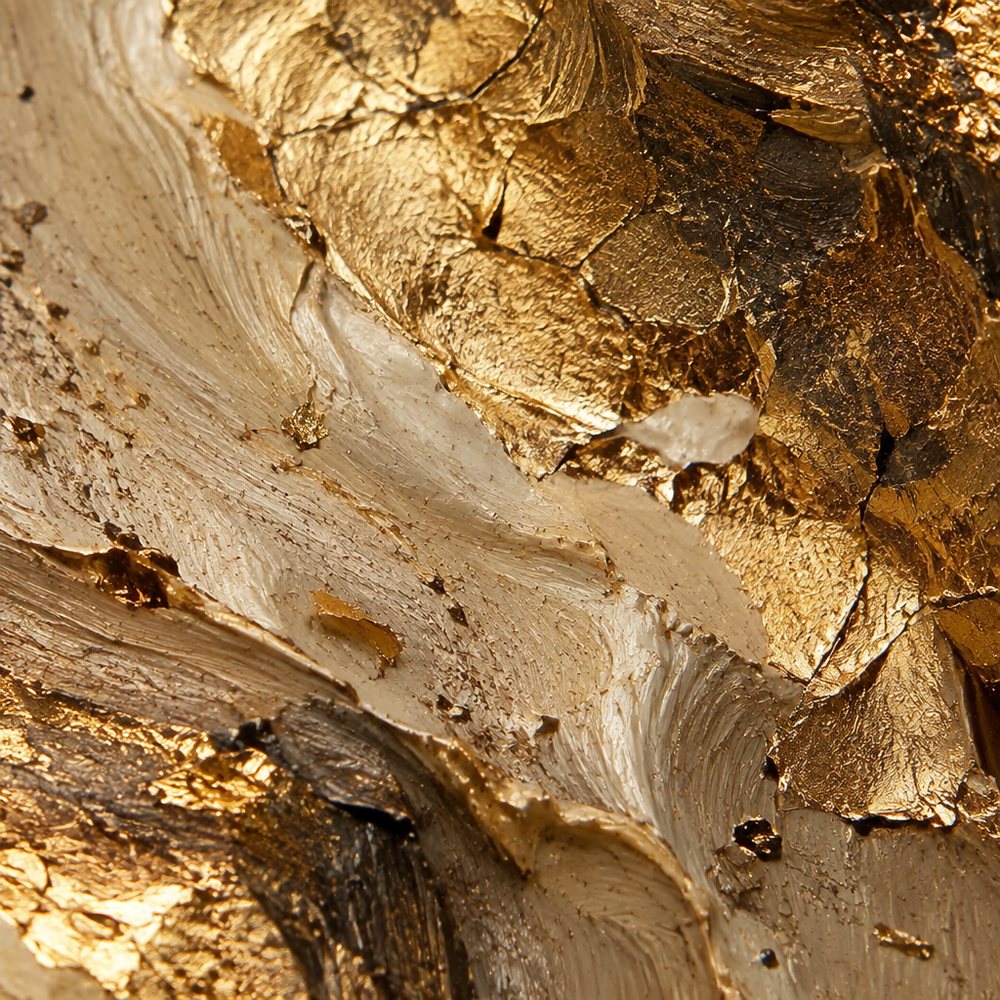Extreme close-up of gold leaf pressed into thick impasto oil paint